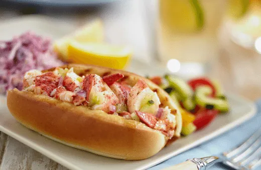 A lobster roll tastes like a lobster tail dipped in butter and served on a bed of lettuce.