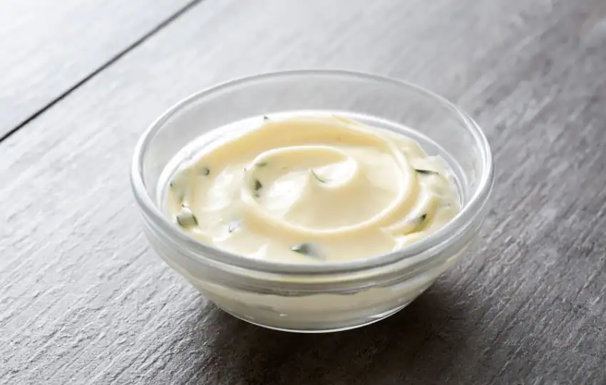 Mayonnaise is a creamy, white condiment often used as a spread on sandwiches and as a dip for vegetables. It is made from a mixture of egg yolks, oil, vinegar or lemon juice, and spices 