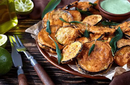 Eggplant is a versatile ingredient that is most often enjoyed fried. With its crisp exterior and creamy center, fried eggplant has a simultaneously light and satisfying texture. 