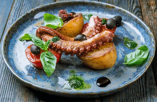 the grilled octopus has a succulent texture with just the right amount of firmness. The flavor is slightly sweet, with a hint of smokiness from the grill. 