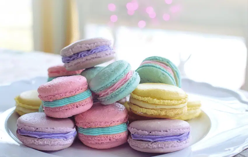 Macarons are a popular French sweet meringue base delicacy made with almond flour, egg whites, and sugar and food color. 